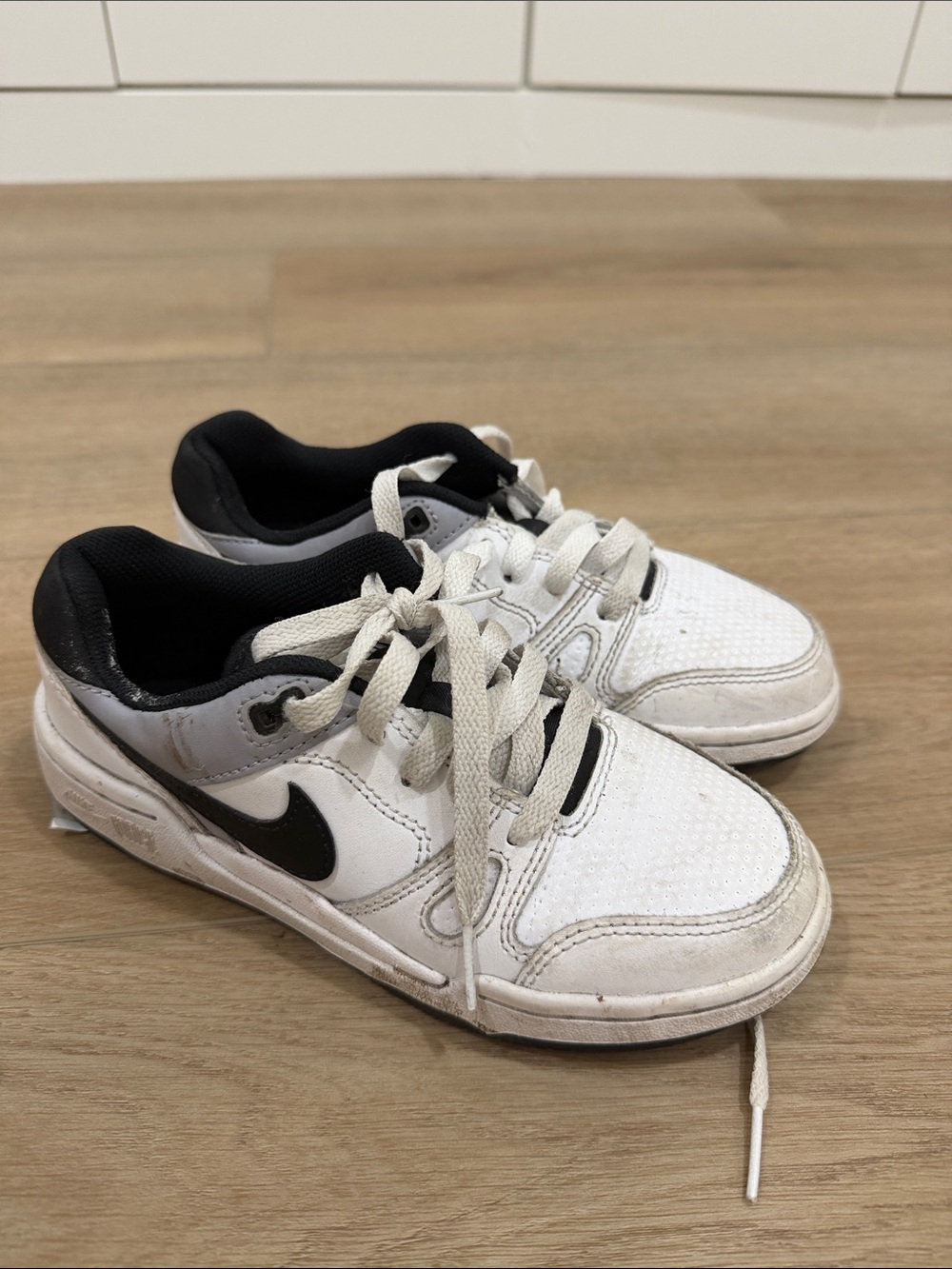 Nike Kids White and Black Low-Top Sneakers with Swoosh